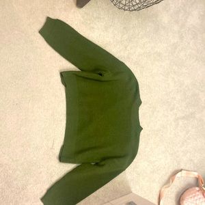 A knit semi cropped green sweater